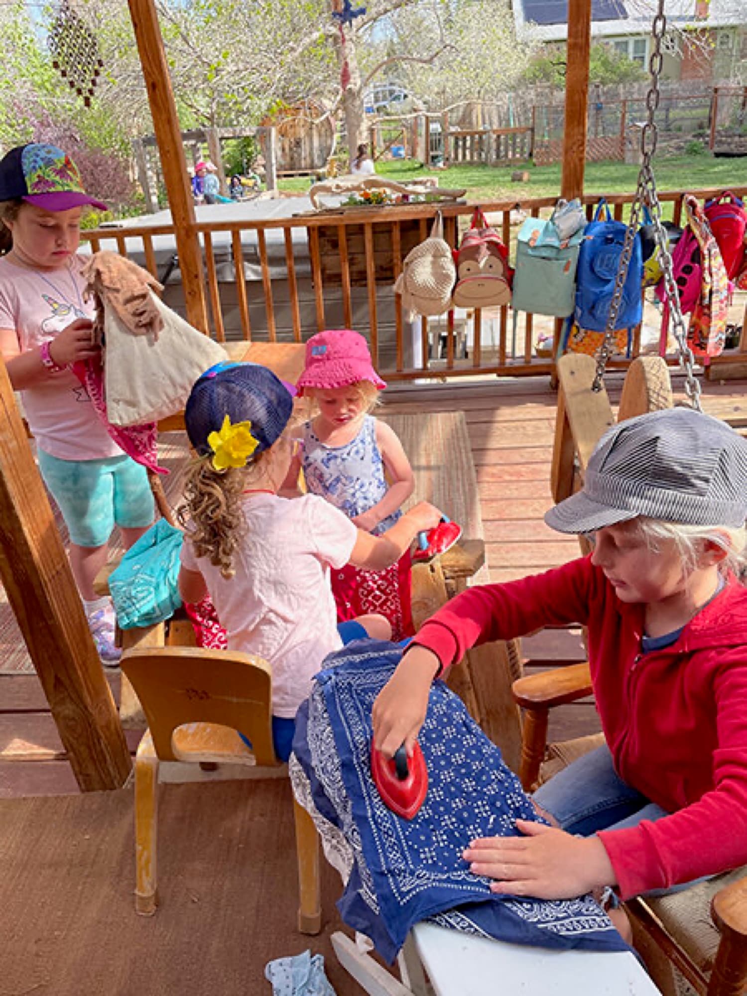 Children deep in play on the shaded porch