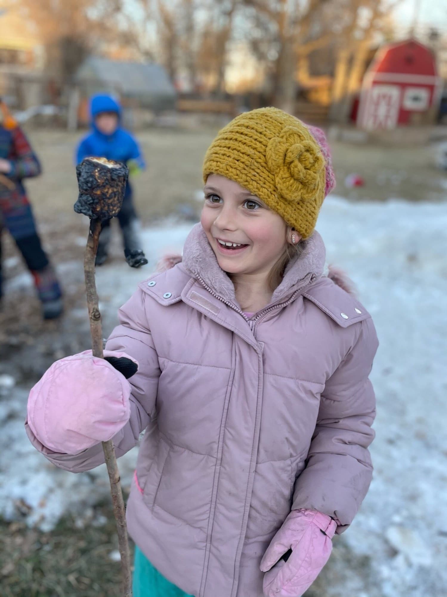A just-toasted marshmallow by the winter fire, snow on the ground